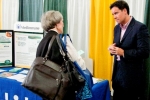 Exhibitor and attendee conversing